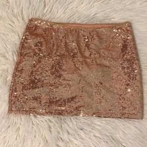 Forever 21 size small. Pink sequin mini skirt.